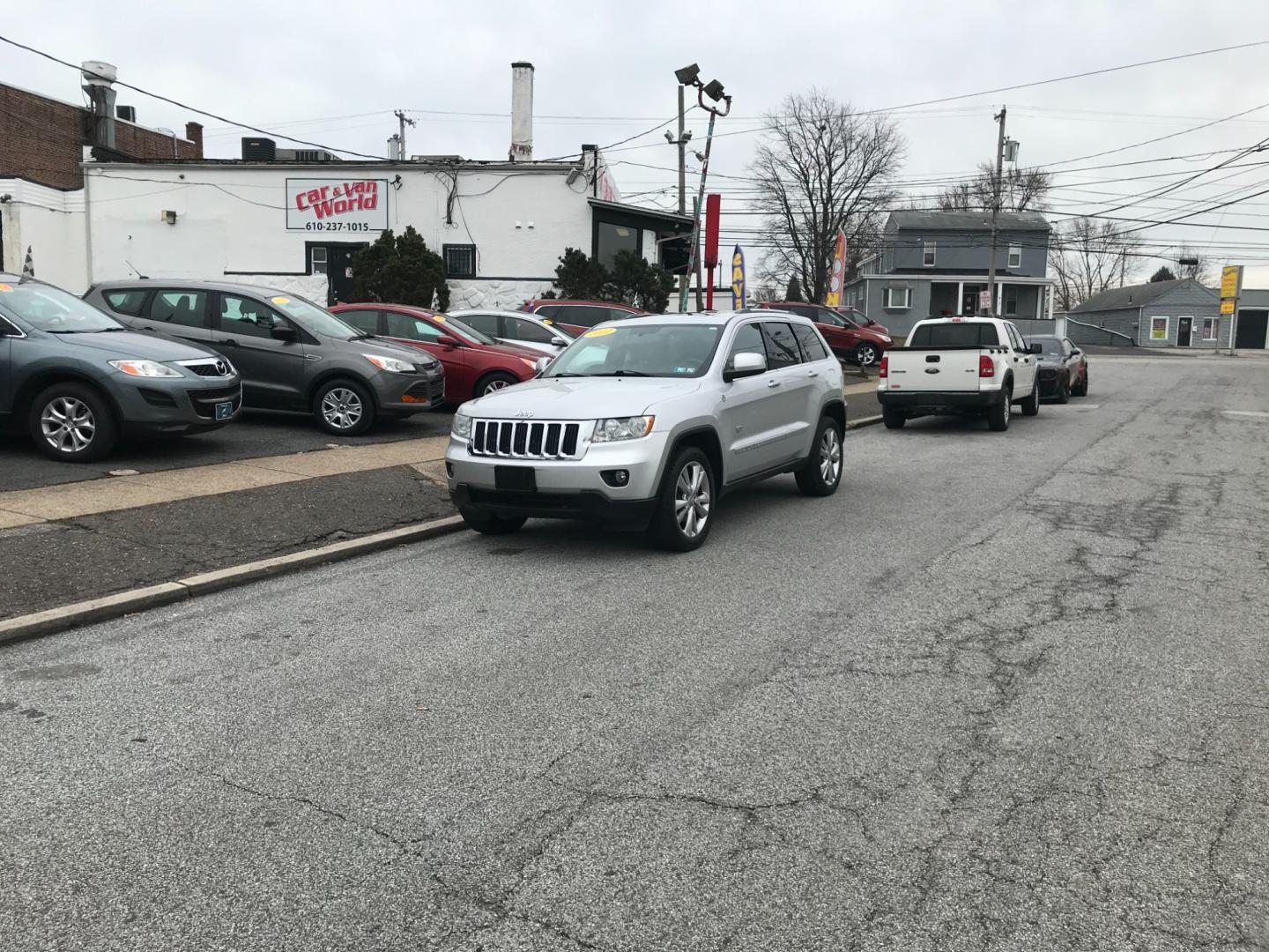 2011 Silver /Black Jeep Grand Cherokee Laredo (1J4RR4GTXBC) with an 5.7 Liter HEMI engine, Automatic transmission, located at 577 Chester Pike, Prospect Park, PA, 19076, (610) 237-1015, 39.886154, -75.302338 - Photo#1